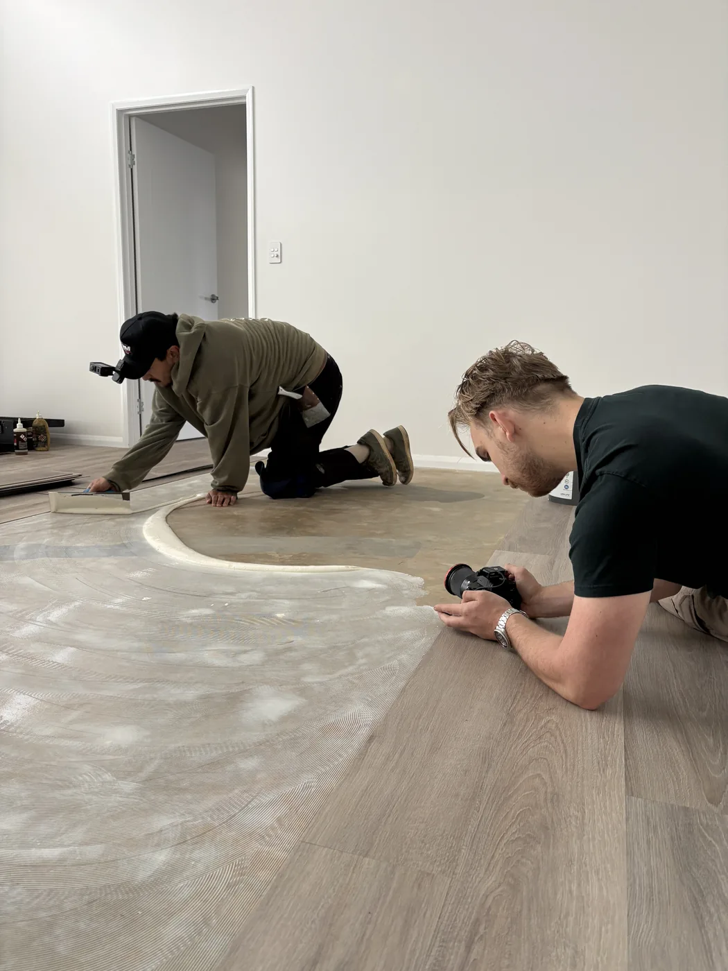 The Ripple Media crew on the floor filming a tradesman at work